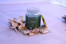 Load image into Gallery viewer, A green hexagonal candle surrounded by birch bark shavings. The label reads: &quot;The Wayside Wizard&quot;, &quot;Endless Forest&quot;, &quot;Hand-poured soy wax candles&quot;. 
