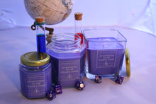 Load image into Gallery viewer, All of the Wayside Wizard&#39;s sizes of the themed dnd candle - An invitation to the Wizard&#39;s Tower. Dice are scattered around, a globe is in the background and a few vials that resemble potions are behind the candles. 
