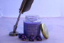 Load image into Gallery viewer, A small 6oz candle. The candle is lavender colored and the label reads: 'The Wayside Wizard', 'An invitation to the Wizard's Tower', 'hand-poured soywax candles'. The candle is surrounded by a set of dice and a quill is to the left of it.